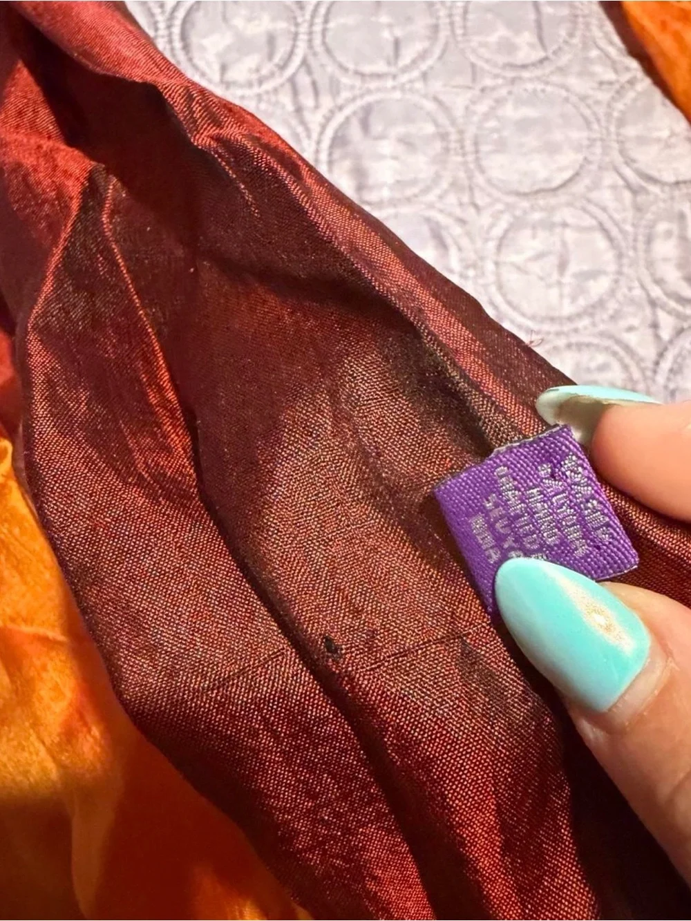 Orange, brown, and teal gradient silk scarf with fringe